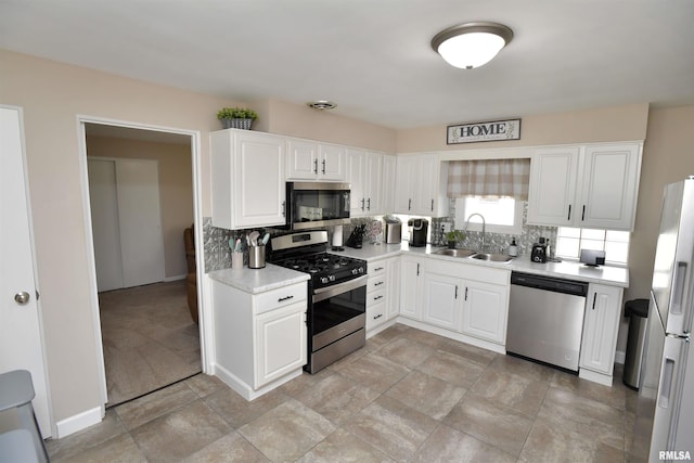 4527 N Nelson Dr, Peoria, IL 61614 - kitchen featuring stainless steel appliances, decorative backsplash, light countertops, and white cabinetry