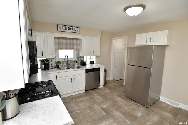 4527 N Nelson Dr, Peoria, IL 61614 - kitchen with appliances with stainless steel finishes, light countertops, decorative backsplash, and white cabinets