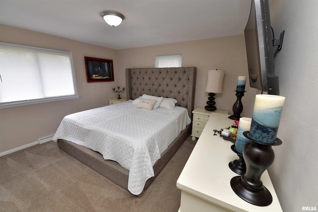 4527 N Nelson Dr, Peoria, IL 61614 - bedroom featuring dark colored carpet and a baseboard heating unit