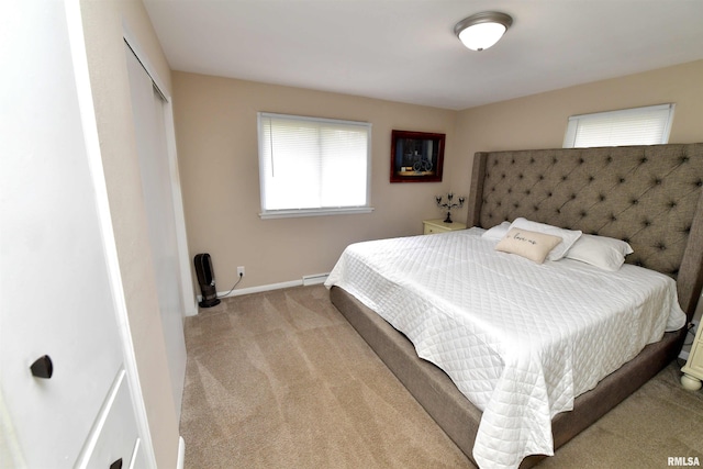 4527 N Nelson Dr, Peoria, IL 61614 - carpeted bedroom featuring baseboards and a closet