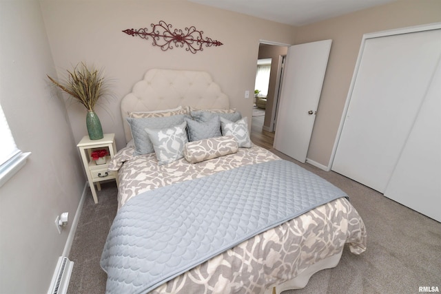 4527 N Nelson Dr, Peoria, IL 61614 - bedroom featuring carpet and a baseboard heating unit