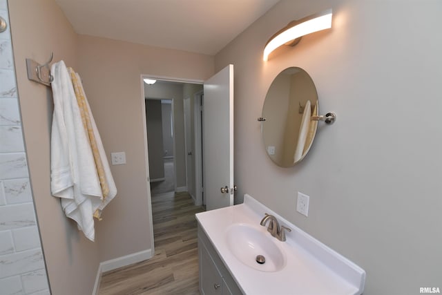 4527 N Nelson Dr, Peoria, IL 61614 - bathroom with vanity and wood finished floors