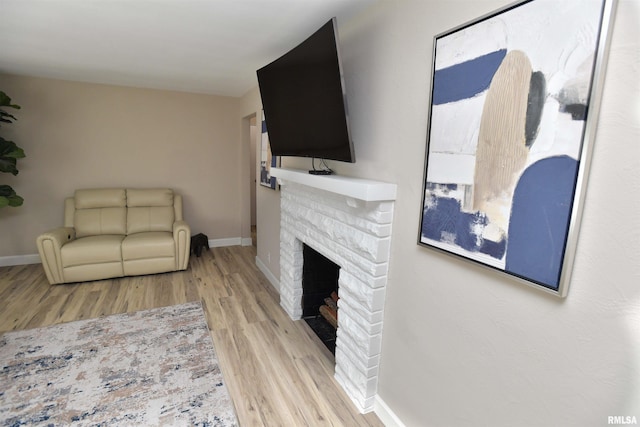 4527 N Nelson Dr, Peoria, IL 61614 - living room featuring wood finished floors and a brick fireplace