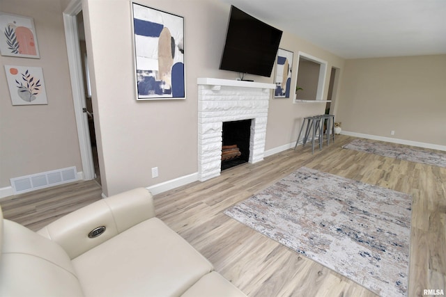 4527 N Nelson Dr, Peoria, IL 61614 - living room featuring wood finished floors and a fireplace