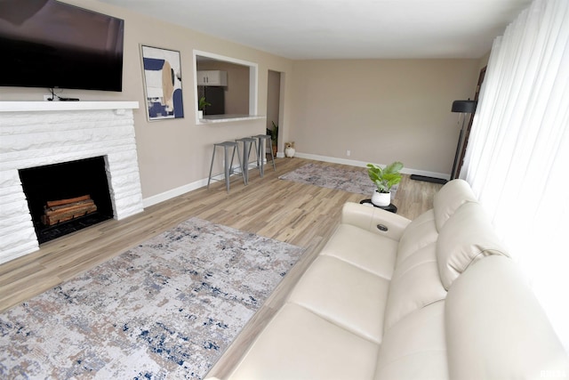 4527 N Nelson Dr, Peoria, IL 61614 - living area featuring wood finished floors and a stone fireplace