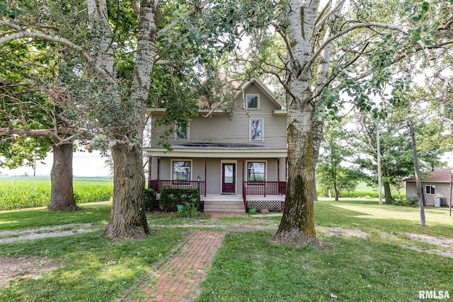 5610 W Lakeshore Dr, Princeville, IL 61559 - view of front of house with covered porch and a front yard
