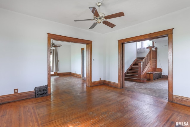 5610 W Lakeshore Dr, Princeville, IL 61559 - unfurnished room featuring a ceiling fan, stairs, and hardwood / wood-style floors