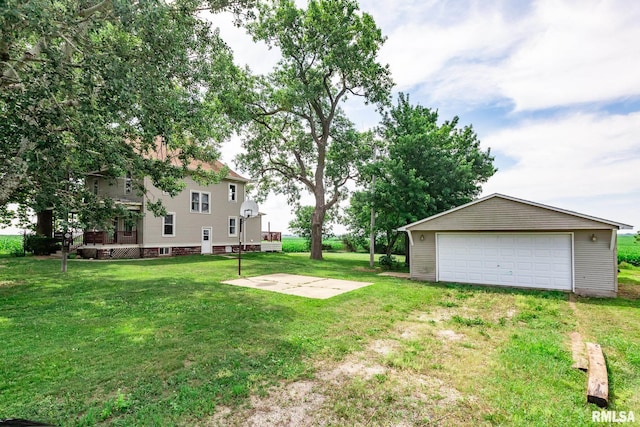 5610 W Lakeshore Dr, Princeville, IL 61559 - view of green lawn with a garage, an outdoor structure, and a wooden deck