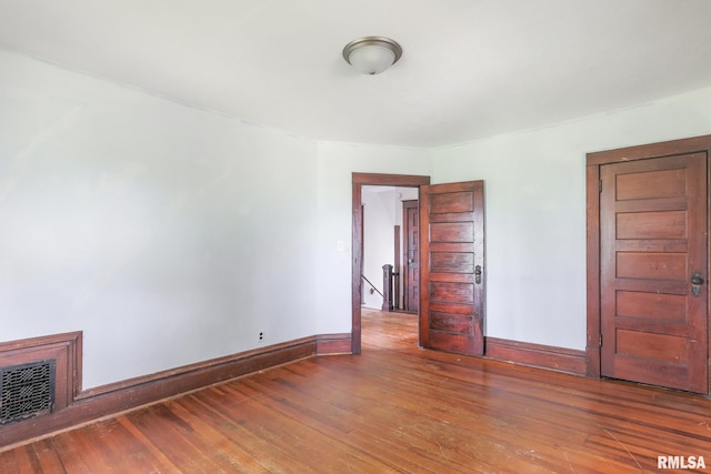 5610 W Lakeshore Dr, Princeville, IL 61559 - spare room featuring wood-type flooring and baseboards