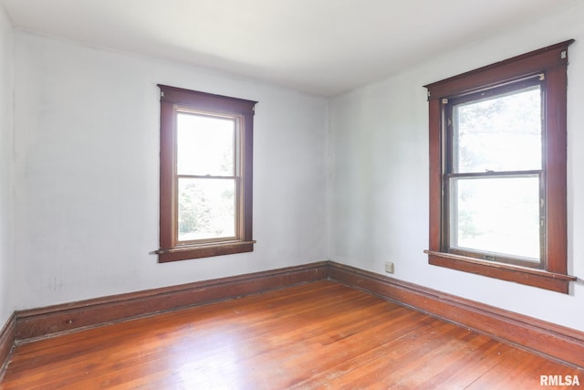 5610 W Lakeshore Dr, Princeville, IL 61559 - unfurnished room featuring hardwood / wood-style flooring and healthy amount of natural light