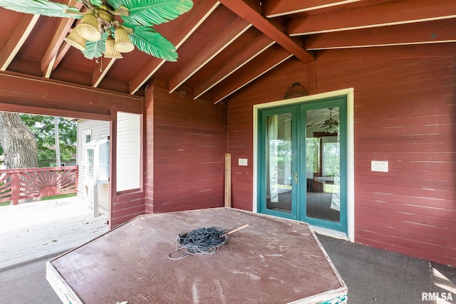 5610 W Lakeshore Dr, Princeville, IL 61559 - unfurnished sunroom featuring french doors, ceiling fan, vaulted ceiling, and healthy amount of natural light