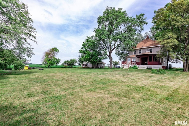 5610 W Lakeshore Dr, Princeville, IL 61559 - view of grassy yard featuring covered porch