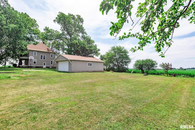 5610 W Lakeshore Dr, Princeville, IL 61559 - view of green lawn with a garage and an outdoor structure