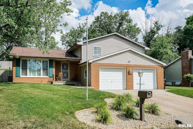 6412 N Brookwood Ln, Peoria, IL 61614 - split level home with brick siding, concrete driveway, and an attached garage