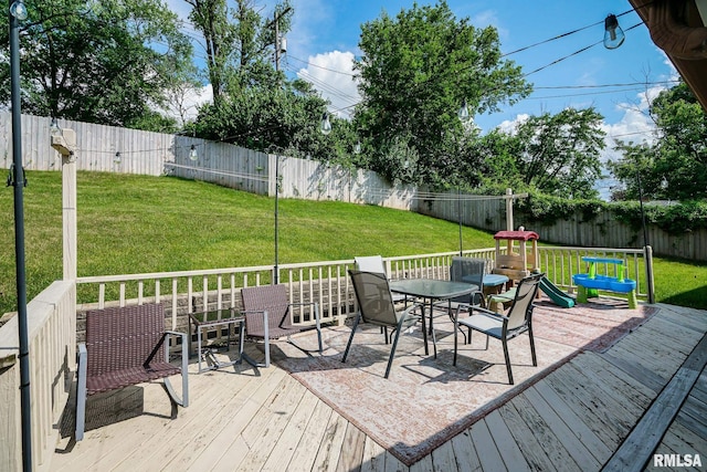 6412 N Brookwood Ln, Peoria, IL 61614 - deck with outdoor dining space and a fenced backyard