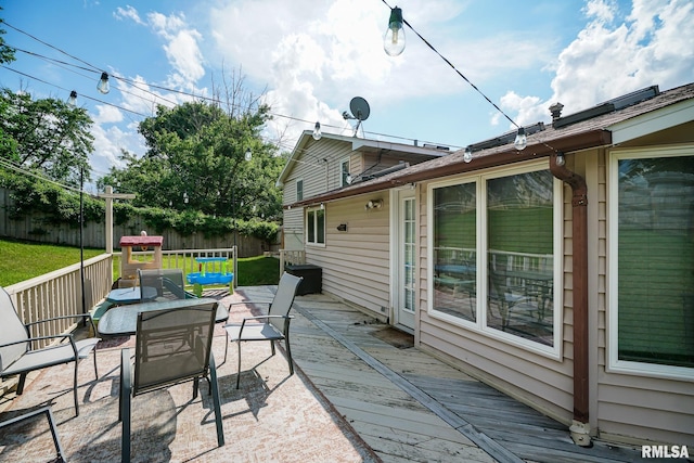 6412 N Brookwood Ln, Peoria, IL 61614 - fenced backyard featuring a deck and outdoor lounge area