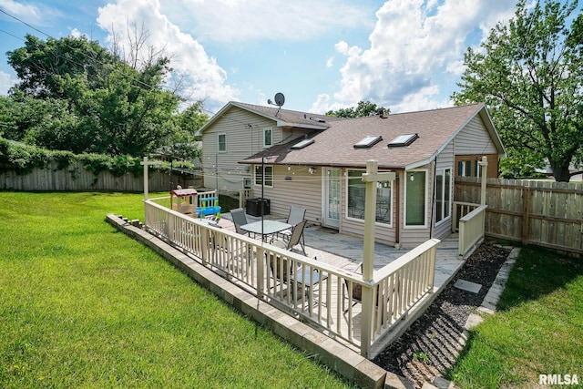 6412 N Brookwood Ln, Peoria, IL 61614 - rear view of house with a shingled roof, a deck, and a fenced backyard