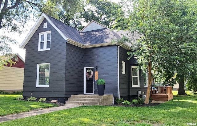 600 E Jefferson St, Washington, IL 61571 - view of front of house featuring a front lawn and a wooden deck