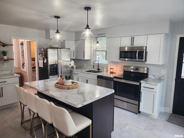 600 E Jefferson St, Washington, IL 61571 - kitchen featuring stainless steel appliances, light marble finish flooring, and light stone counters