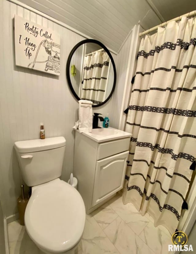 600 E Jefferson St, Washington, IL 61571 - full bathroom with marble finish floors, vanity, wooden walls, and a shower with shower curtain