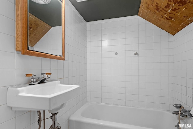 1426 N Main St, East Peoria, IL 61611 - bathroom with tile walls and washtub / shower combination