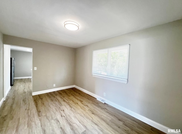 4914 N Bevalon Pl, Peoria, IL 61614 - spare room with wood finished floors and baseboards