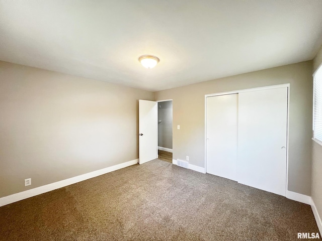 4914 N Bevalon Pl, Peoria, IL 61614 - unfurnished bedroom with carpet and a closet