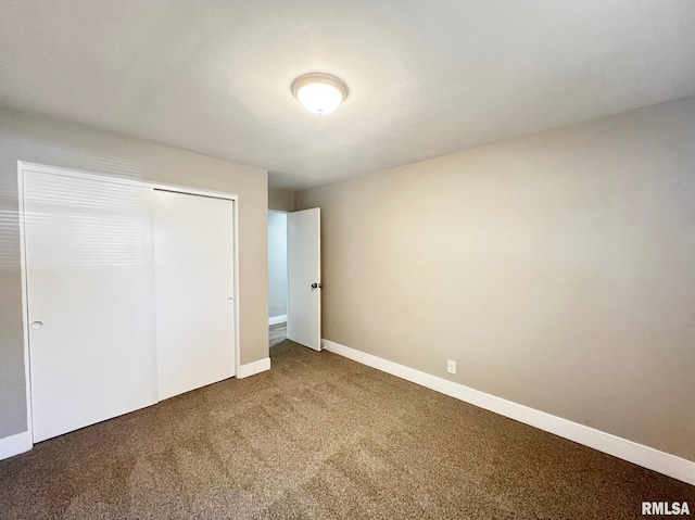 4914 N Bevalon Pl, Peoria, IL 61614 - unfurnished bedroom featuring carpet and a closet