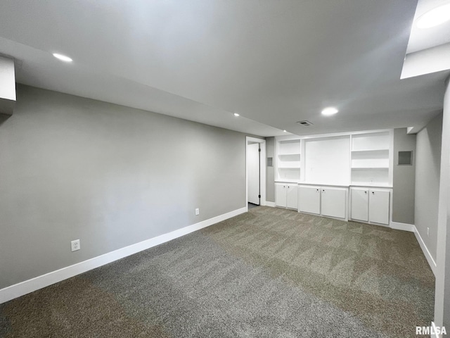4914 N Bevalon Pl, Peoria, IL 61614 - finished basement featuring carpet floors, recessed lighting, and built in shelves