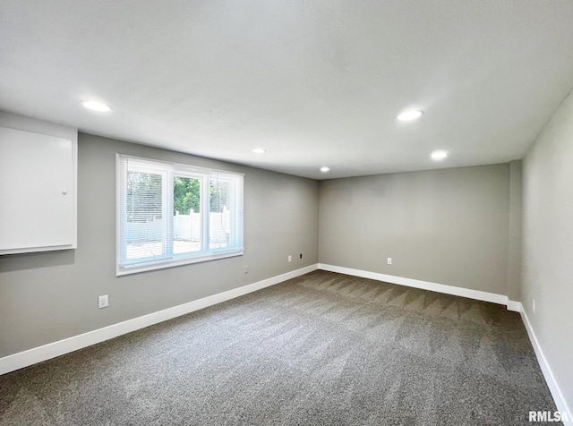 4914 N Bevalon Pl, Peoria, IL 61614 - empty room with dark colored carpet and recessed lighting