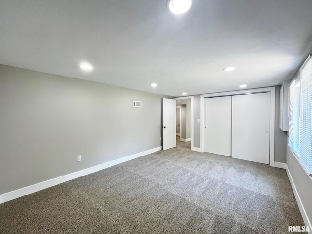 4914 N Bevalon Pl, Peoria, IL 61614 - unfurnished bedroom featuring recessed lighting, carpet floors, and a closet