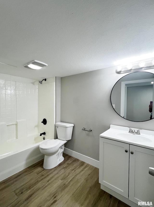 4914 N Bevalon Pl, Peoria, IL 61614 - bathroom featuring vanity, wood finished floors,  shower combination, and a textured ceiling