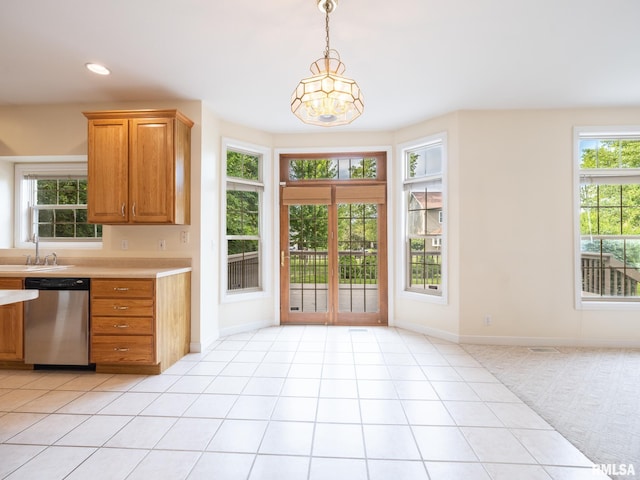 919 W Brookforest Dr, Peoria, IL 61615 - kitchen with stainless steel dishwasher, light countertops, healthy amount of natural light, hanging light fixtures, and recessed lighting