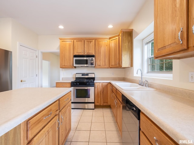 919 W Brookforest Dr, Peoria, IL 61615 - kitchen with stainless steel appliances, light countertops, light tile patterned floors, and recessed lighting