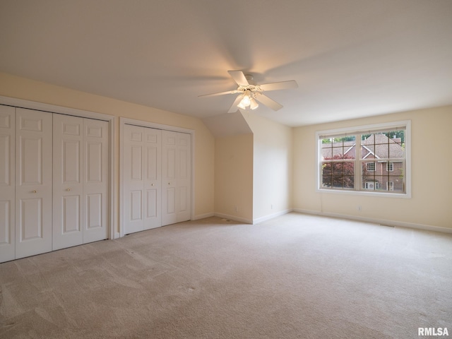 919 W Brookforest Dr, Peoria, IL 61615 - unfurnished bedroom featuring carpet flooring, two closets, and a ceiling fan