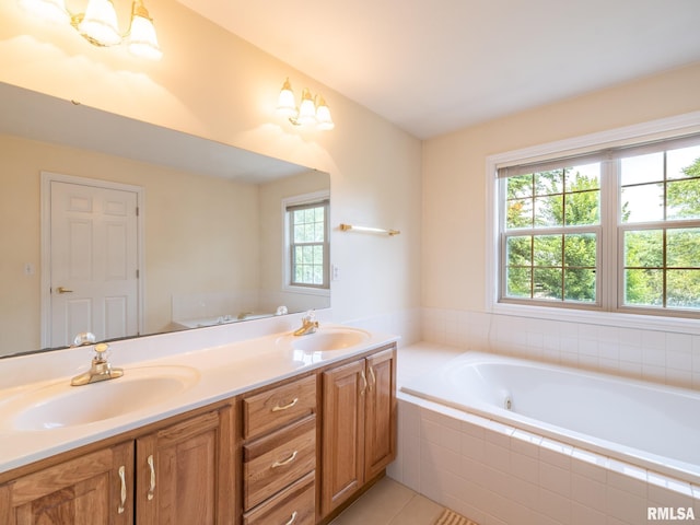 919 W Brookforest Dr, Peoria, IL 61615 - full bath featuring double vanity, a whirlpool tub, and tile patterned floors