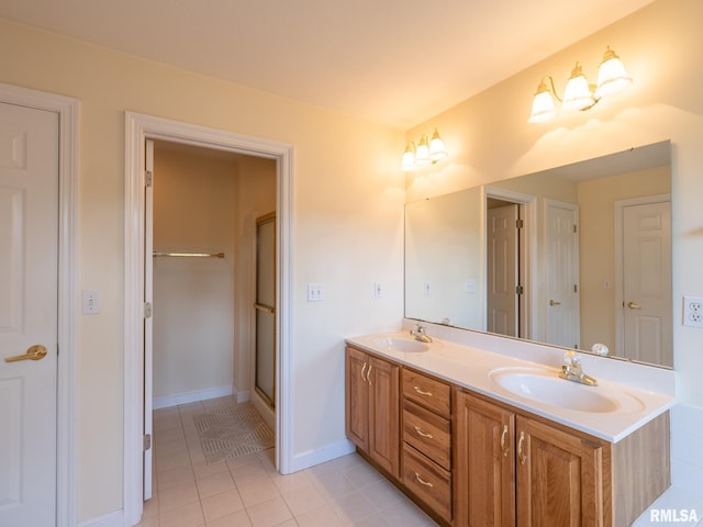 919 W Brookforest Dr, Peoria, IL 61615 - full bath featuring double vanity and tile patterned floors