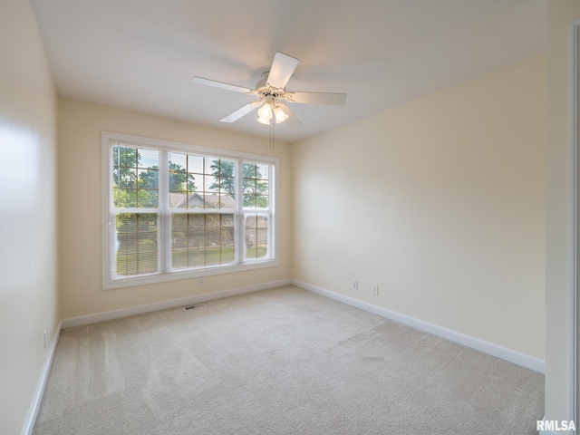 919 W Brookforest Dr, Peoria, IL 61615 - empty room featuring light colored carpet and a ceiling fan