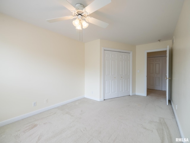 919 W Brookforest Dr, Peoria, IL 61615 - unfurnished bedroom with light carpet, a closet, and a ceiling fan