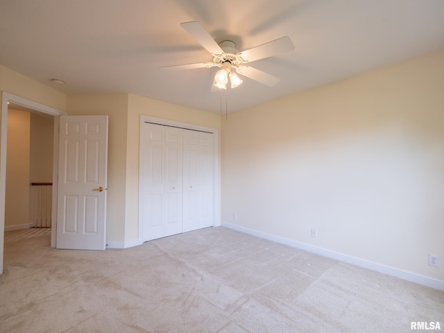 919 W Brookforest Dr, Peoria, IL 61615 - unfurnished bedroom with light carpet, a closet, and ceiling fan