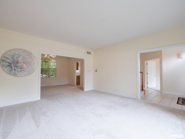919 W Brookforest Dr, Peoria, IL 61615 - spare room with light carpet and a chandelier