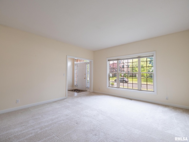 919 W Brookforest Dr, Peoria, IL 61615 - spare room featuring light carpet and baseboards