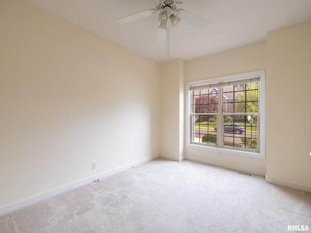 919 W Brookforest Dr, Peoria, IL 61615 - spare room with light colored carpet and a ceiling fan