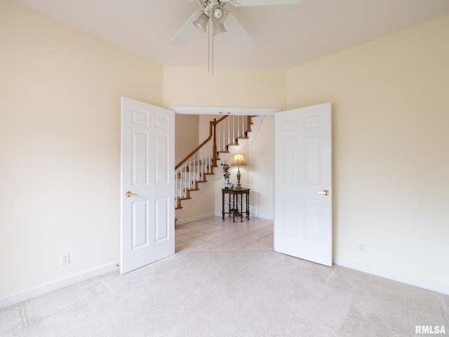 919 W Brookforest Dr, Peoria, IL 61615 - carpeted spare room with ceiling fan and stairway