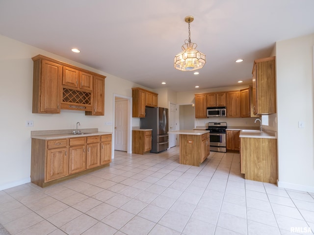 919 W Brookforest Dr, Peoria, IL 61615 - kitchen with appliances with stainless steel finishes, light countertops, recessed lighting, a center island, and light tile patterned floors