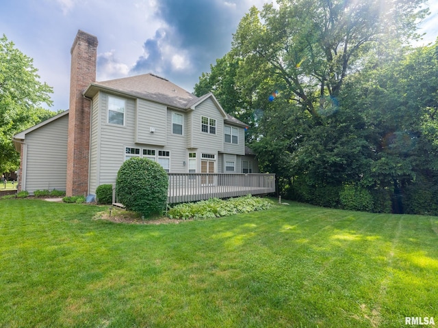919 W Brookforest Dr, Peoria, IL 61615 - rear view of property with a chimney, a yard, and a wooden deck