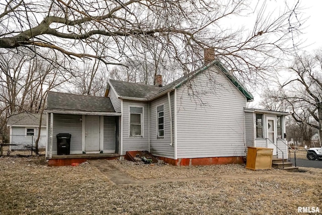 1300 W Martin St, Peoria, IL 61605 - view of home's exterior with a chimney