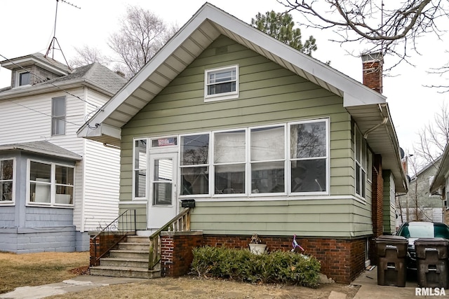 1602 NE Monroe St, Peoria, IL 61603 - view of front of property with a chimney