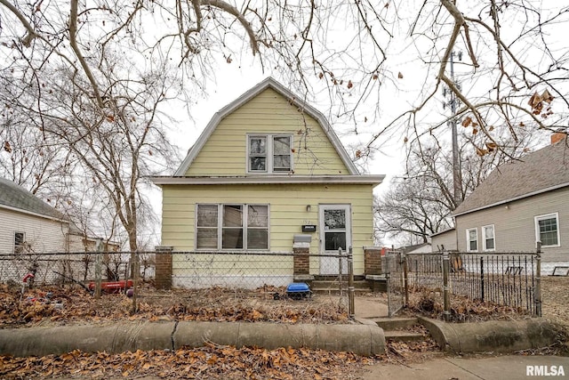 1929 Stanley St, Peoria, IL 61605 - dutch colonial featuring a gambrel roof and a gate