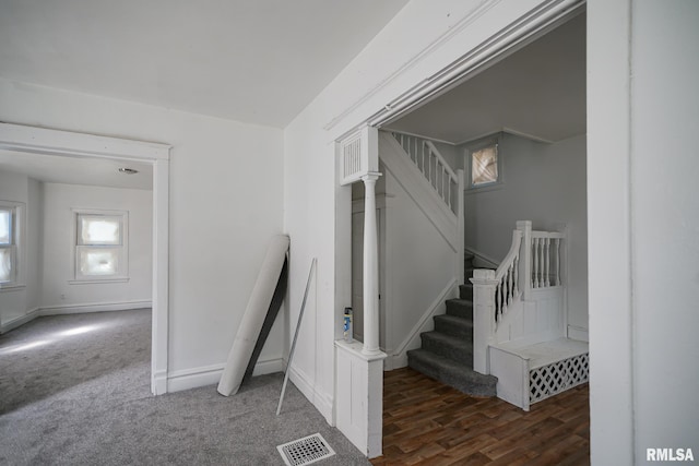 506 Spring St, Peoria, IL 61603 - staircase with baseboards and wood finished floors